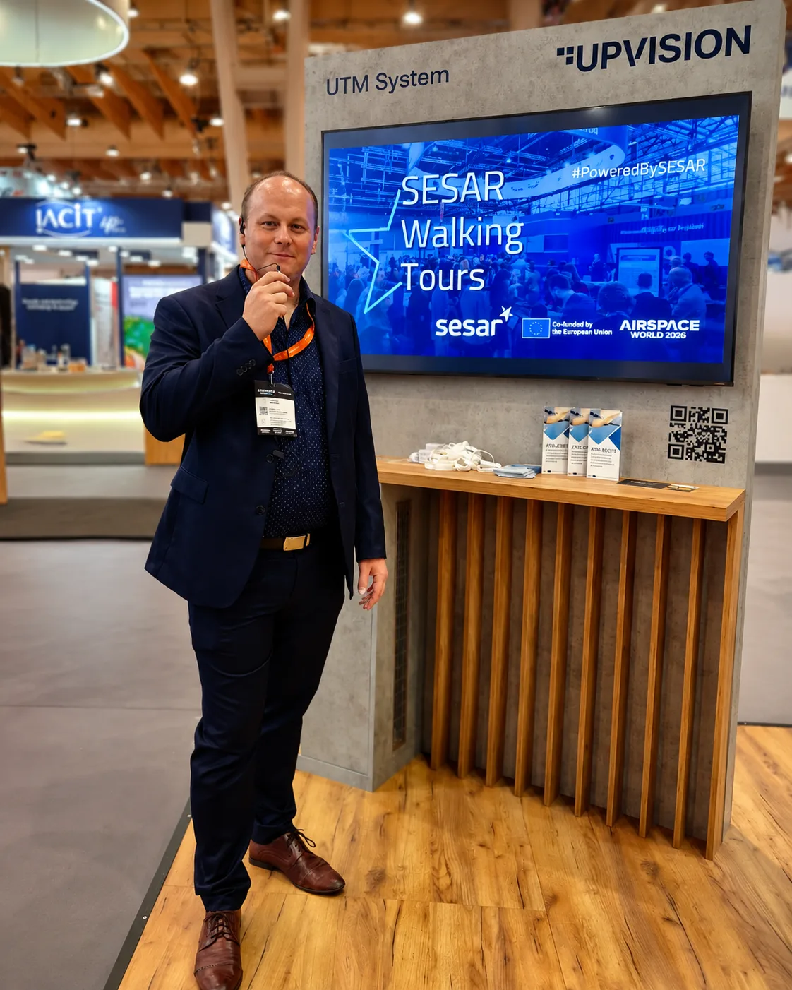 Jakub from UPVISION at the SESAR Walking Tours booth at Airspace World 2026, with ATM-EXCITE brochures on display